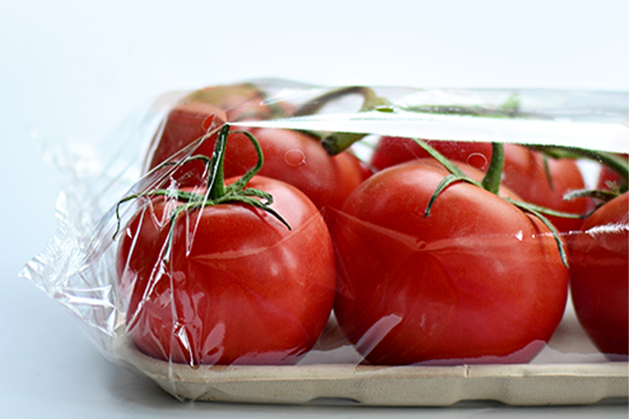 Tomatoes wrapped in plastic to preserve freshness