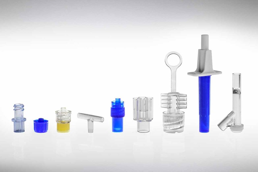 An assortment of plastic components by Adam Spence Corporation