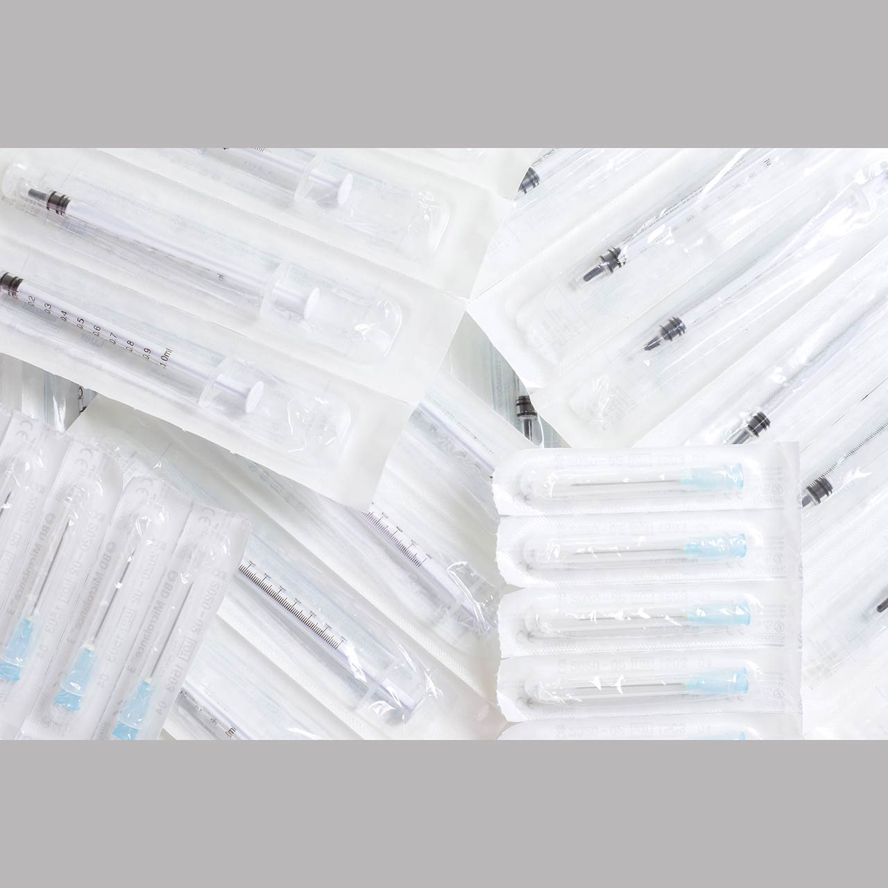 Plastic packaging containing hypodermic needles