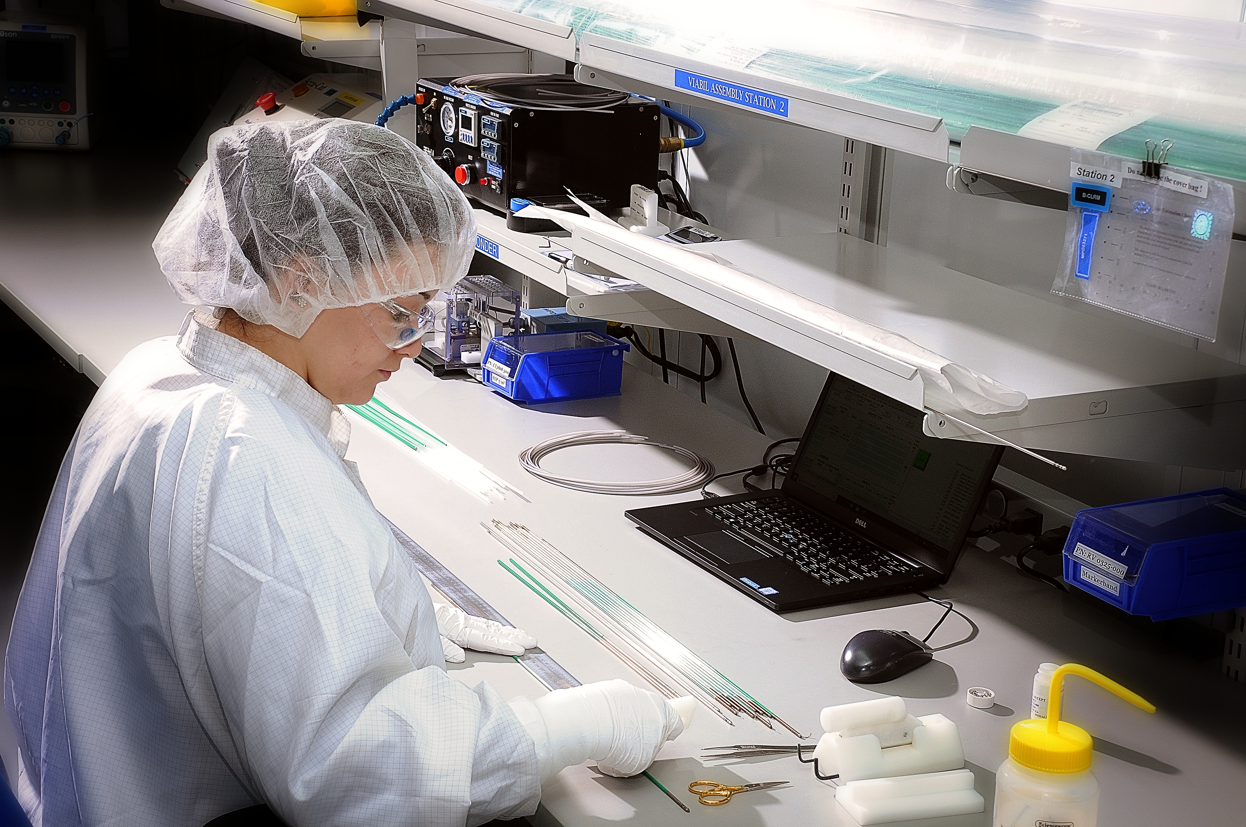 An SPG extrusion expert manufacturing catheter extrusions in a clean work area